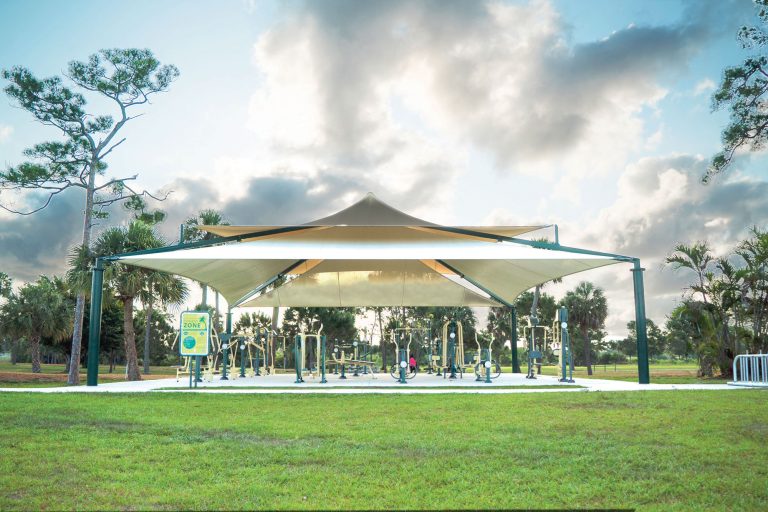 Outdoor fitness equipment under shade at John Prince Park