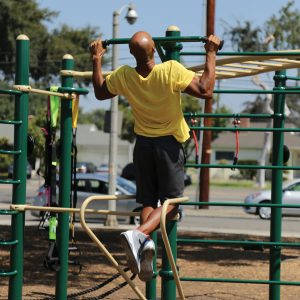 A man using the Lat Pull Up Bar