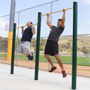 Two men using the 2-Person Pull-Up Station