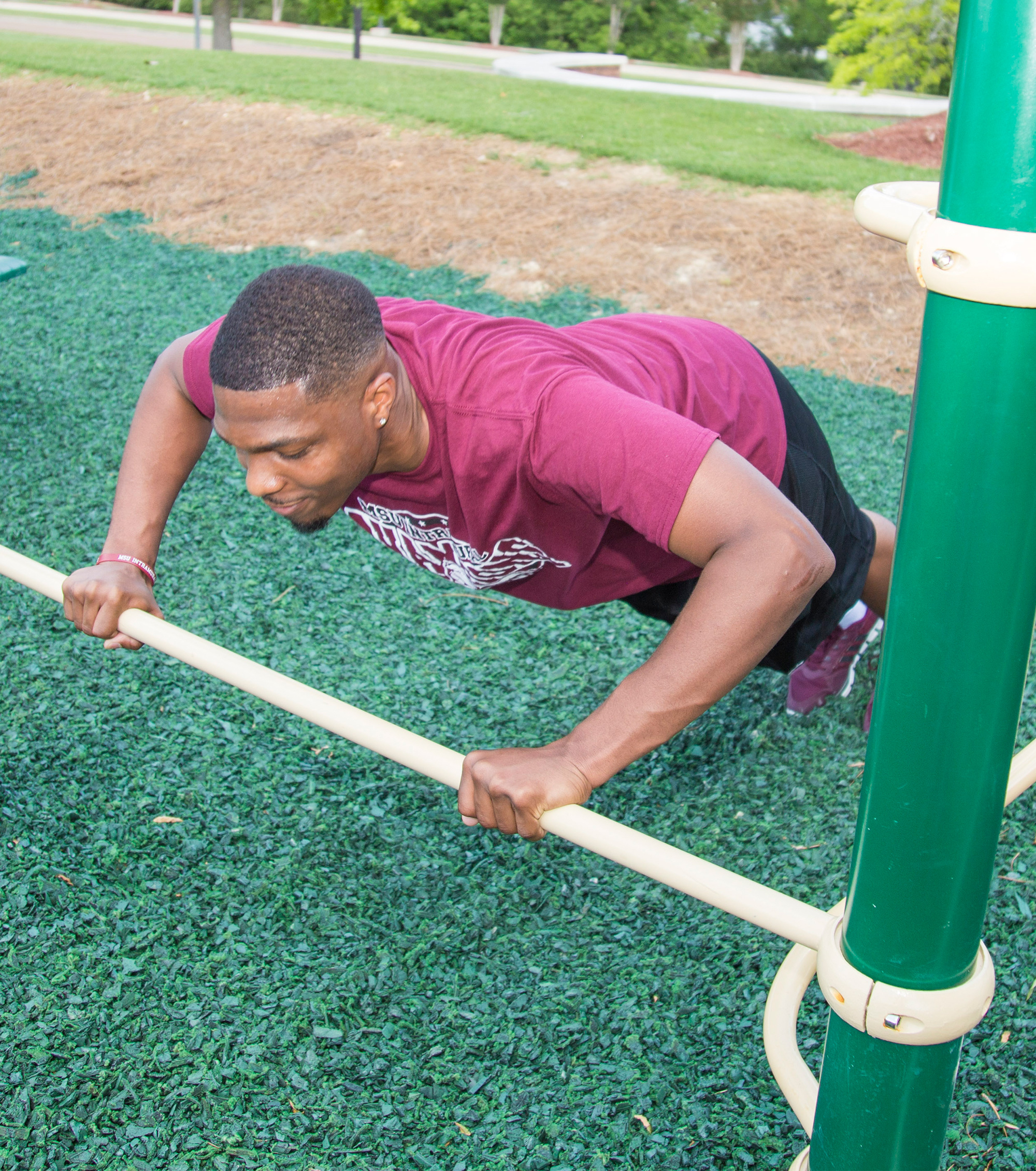A man using assisted push up bar