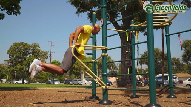 A man using the dip station
