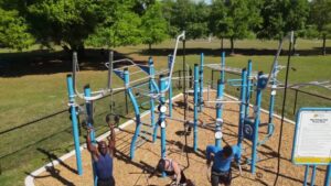 Three men exercising on a blue Custom Functional Fitness Rig at West Orange Park