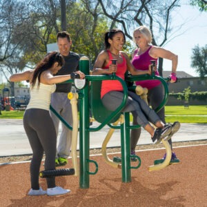 Three men and a woman using the 4-Person Lower Body Combo