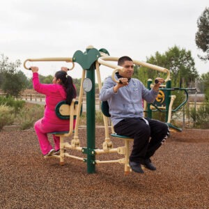 A man and woman using 2-person lat pull