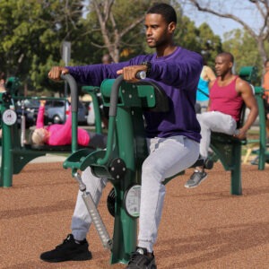 A man using the adjustable resistance rowing machine