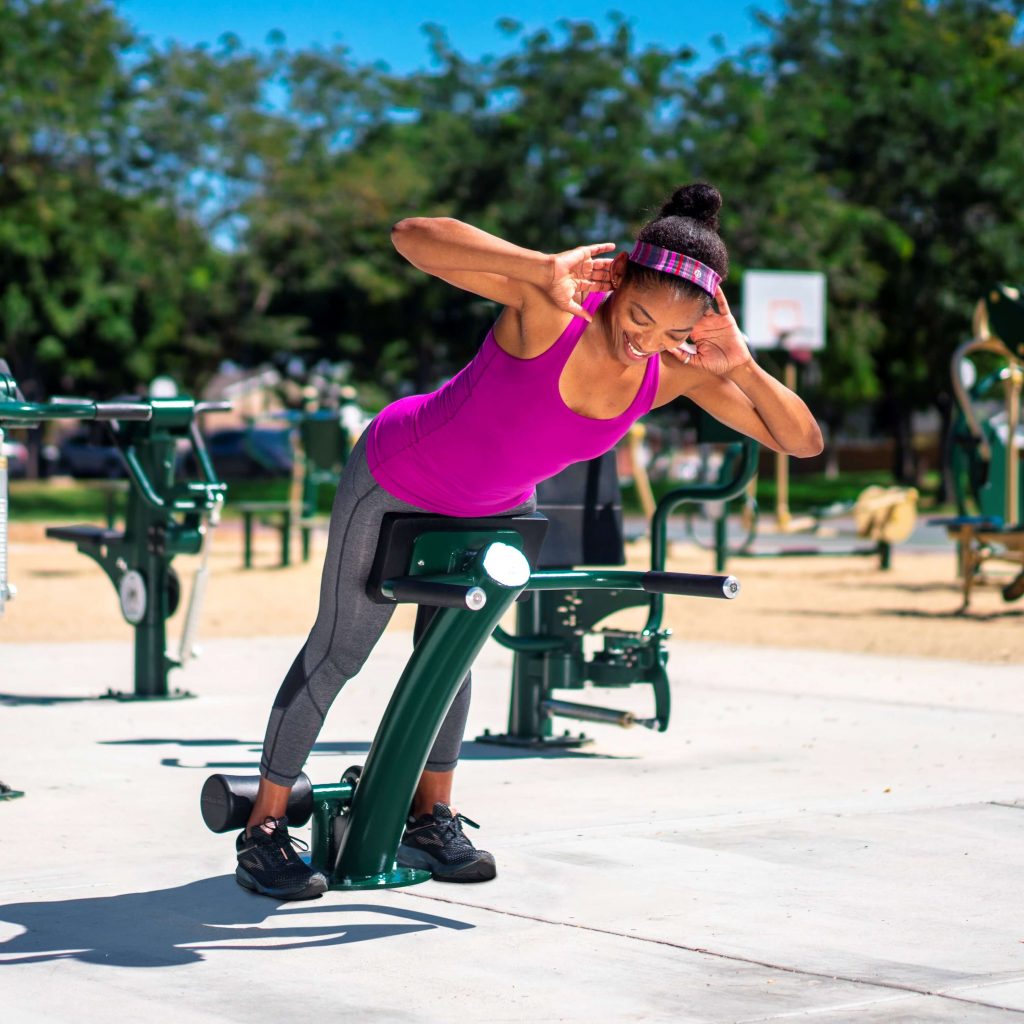 A woman using back extension to exercise