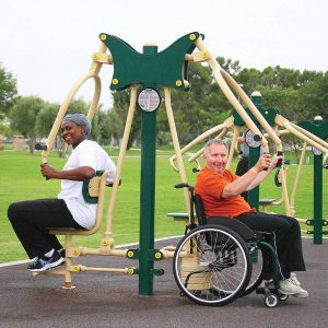 A man in wheelchair and a woman in wheelchair accessible chest press