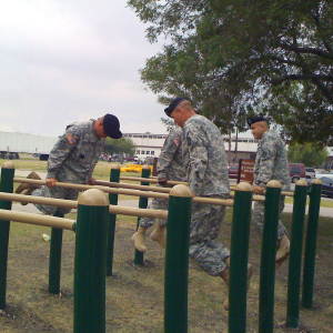 Soldiers using parallel bars